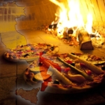 Pizzen im traditionellen Holzbackofen